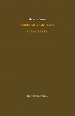 Sobre mi almohada una cabeza